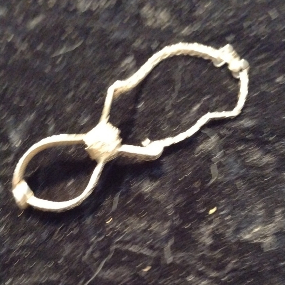 Antique glove clip for purse.